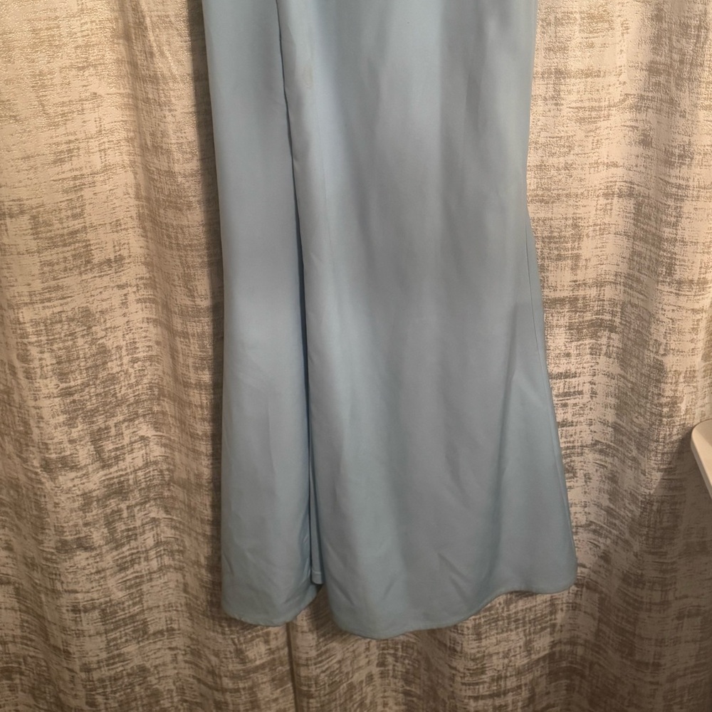 Long blue dress with ruffle off the shoulder design